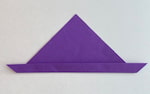 The bottom edge of the triangle is folded, about a quarter of the way up.