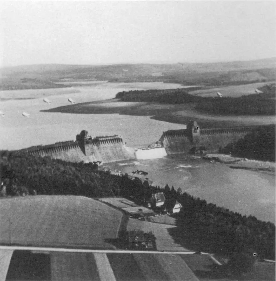 A black and white aerial view of the Möhne Dam.