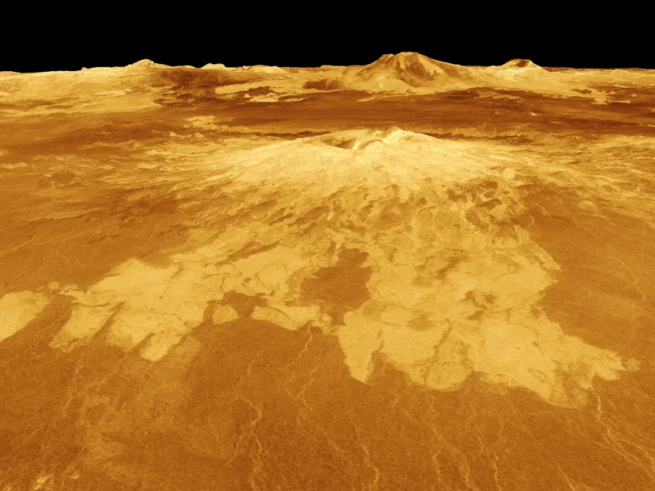 An angled 3D view of the surface a Venus, showing a volcanic mound with lava flowing towards the foreground, and more volcanoes and the horizon in the background.