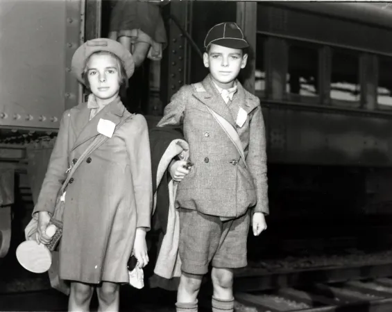 Two young evacuee children from Great Britain, standing at Bonaventure Station, Montreal, Quebec. August 1941.