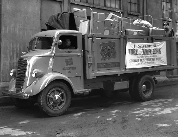 Canadian National cartage truck transporting women's and children's clothing for shipment oversees, in 1940.