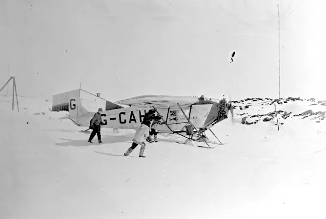 Black and white photograph of airplane G-CAHF taxying down the slipway