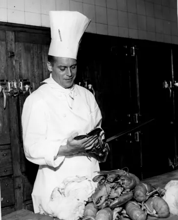 Chef at Nova Scotian Hotel, Eddie Gebistorf, preparing a lobster dish
