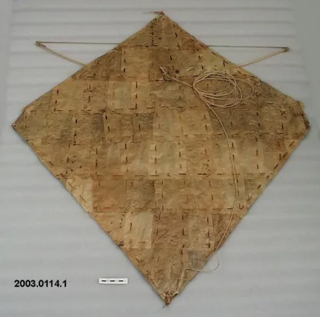 A representative example of a type of leaf kite known as a kaghati. The kamuu, a bamboo bow whose sound is designed to keep birds away from valuable crops, is clearly visible. CASM.