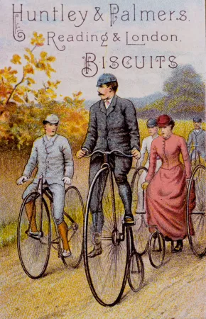 A gentleman on a crossframe safety bicycle escorts a gentleman on a high wheeler and a lady on a tricycle, circa 1890.