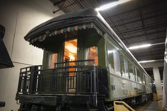 Interior lights glow within the Governor General’s green rail car.