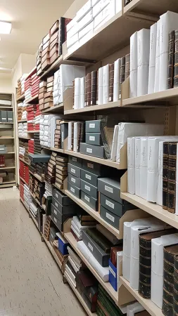 Photo showing wrapped and boxed books in the old rare book room