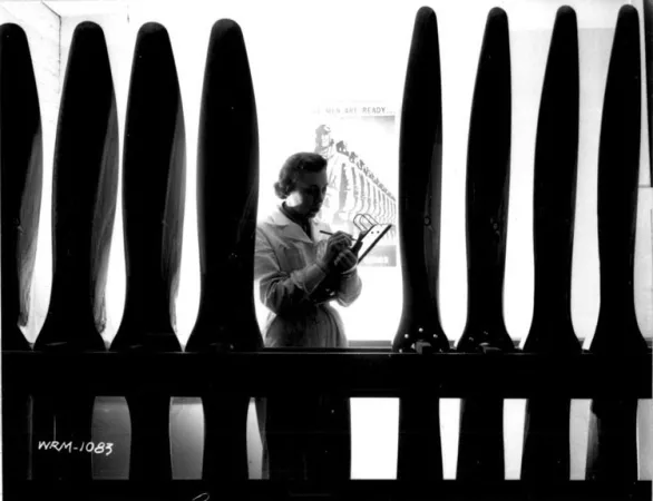historic image of a woman counting airplane propellers 