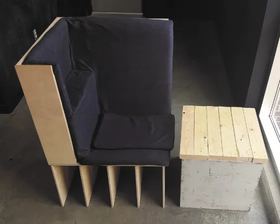 A model of a modern-looking chair and side table