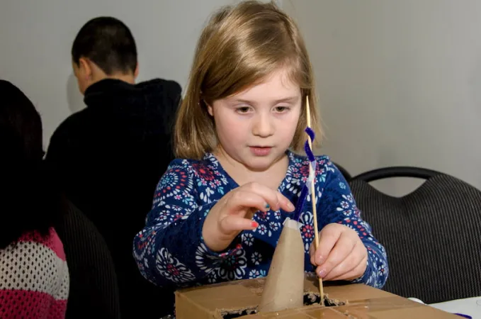 Young girl building a structure in Exploratek