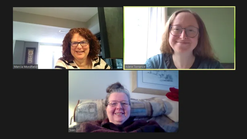Three women are visible in separate windows in a virtual meeting screen.
