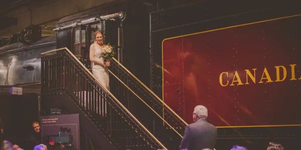 Bride coming out of the 6400/U4A locomotive at a wedding in the Locomotive Hall