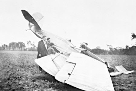 Two men and a boy looking at Curtiss-Reid Rambler that crashed at Cartierville