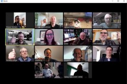 A computer screen shows 14 people taking part in a video coffee chat over Zoom.