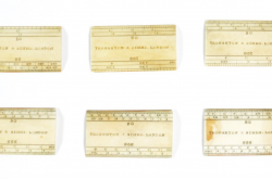 Six small rulers from a drafting kit are presented on a white background.