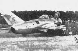 The Mikoyan-Gurevich MiG-15 piloted by Second Lieutenant Franciszek Jarecki, Rønne airfield, Rønne, Denmark. Jarecki is the gentleman marked by an arrow. Anon., “Undamaged Red Jet in NATO Hands.” The Gazette, 7 March 1953, 2.