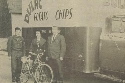 A smiling Mrs. Élie Fortin of Montmagny, Québec, accepting the bicycle won by her daughter, Michèle Fortin, in a contest organised by Dulac Potato Chips Incorporated of Sainte-Marie, Québec. Anon., “–.” Le Peuple, 10 May 1963, 10.